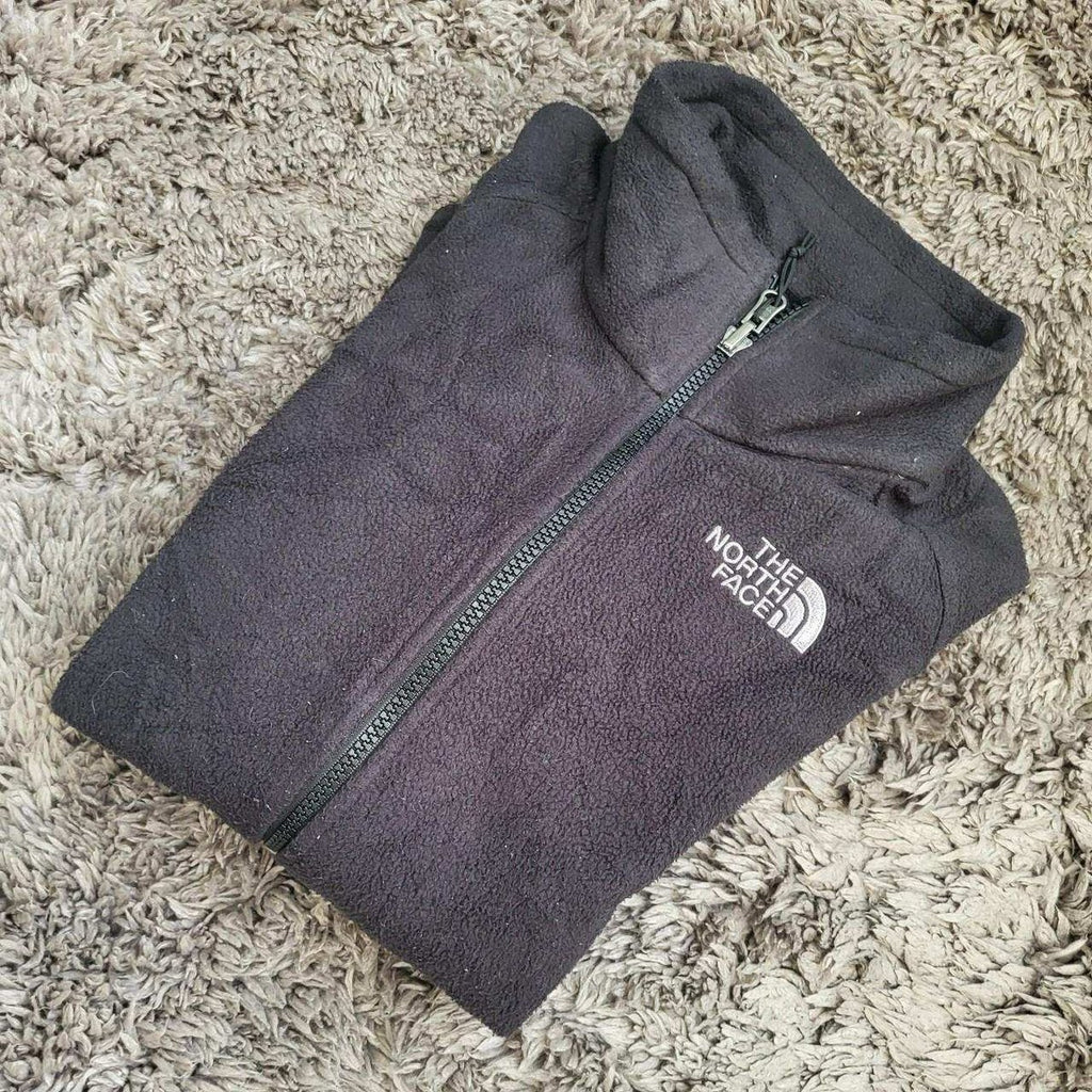 Veste polaire noire The North Face taille S pour femme, logo visible. Fripes Sélect