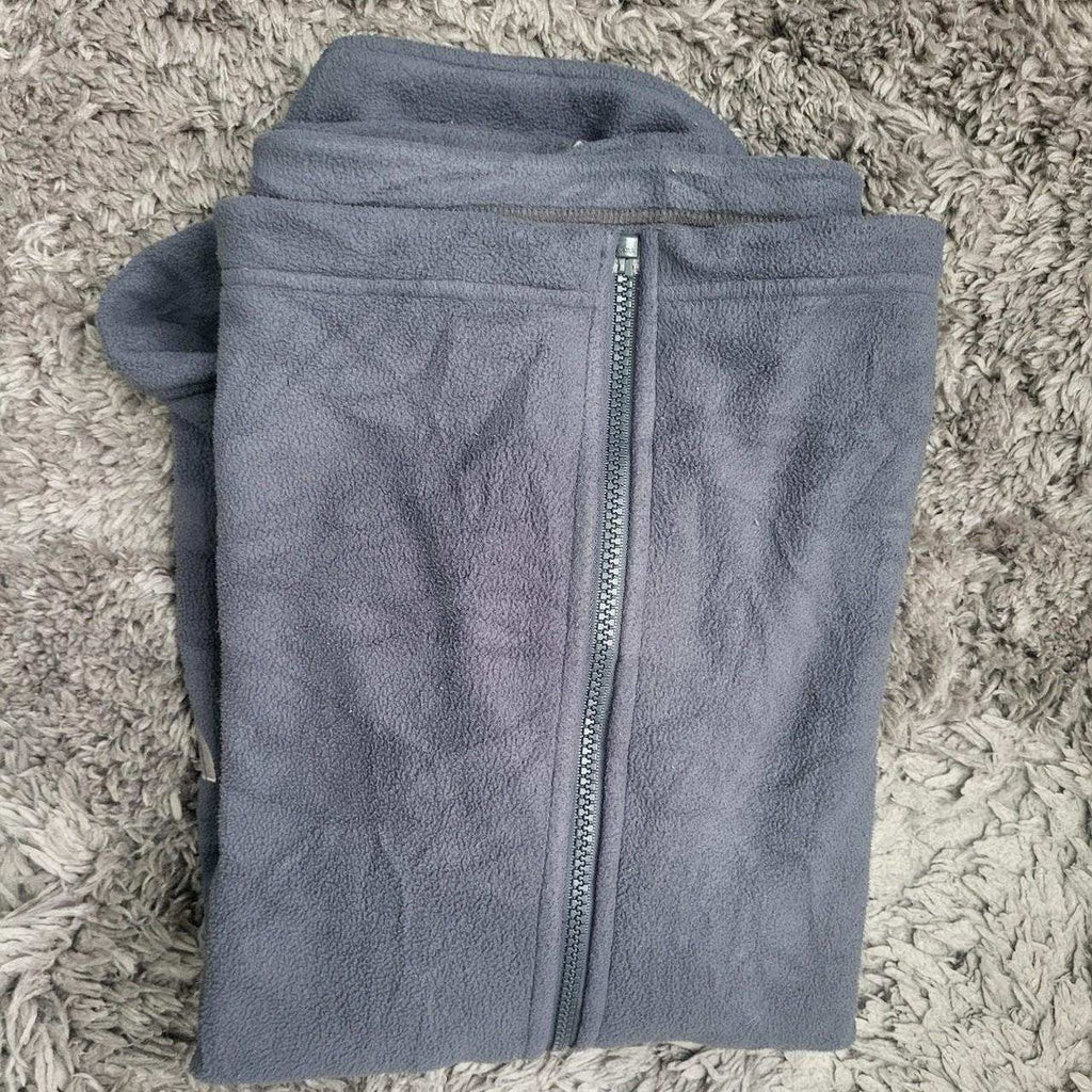 Pull polaire gris homme The North Face taille L plié sur tapis, Fripes Sélect