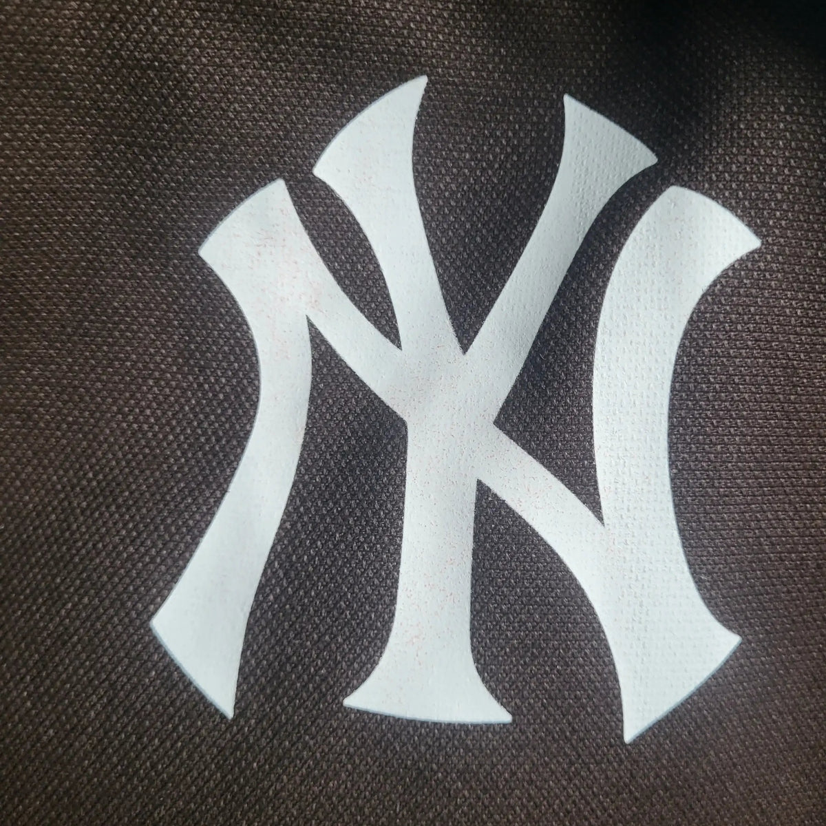Veste sans manches Carhartt marron taille XL, logo NY blanc visible. Fripes Sélect