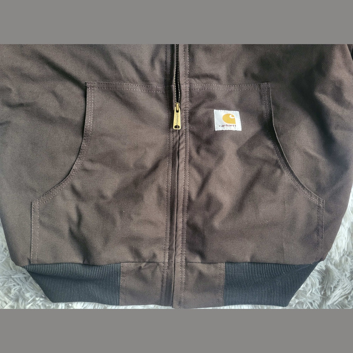 Veste Carhartt marron taille XL avec poches avant. Fripes Sélect