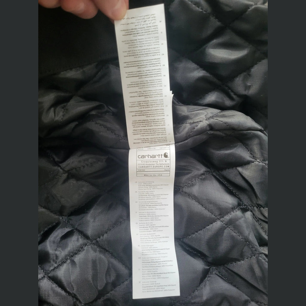 Veste Carhartt noire taille L, étiquette visible. Fripes Sélect