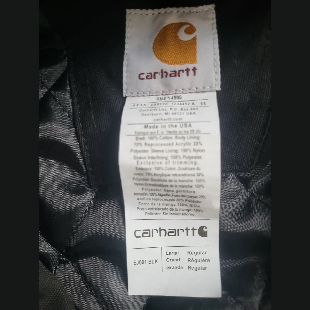 Veste Carhartt noire taille L, étiquette visible. Fripes Sélect