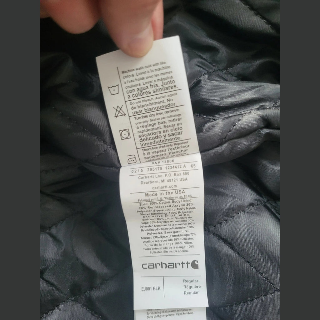 Veste Carhartt noire, taille L, étiquette visible. Fripes Sélect