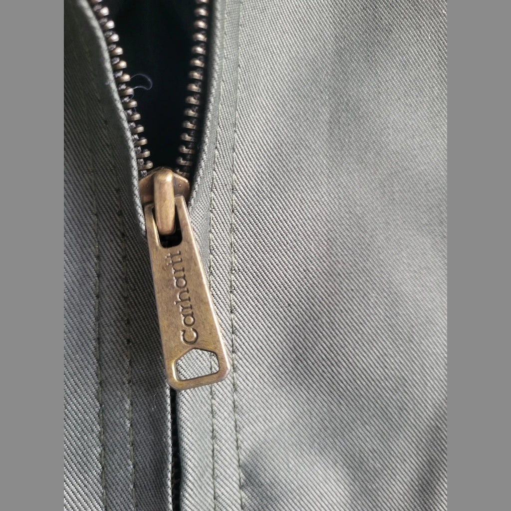 Veste Carhartt kaki taille M, gros plan sur fermeture éclair. Fripes Sélect