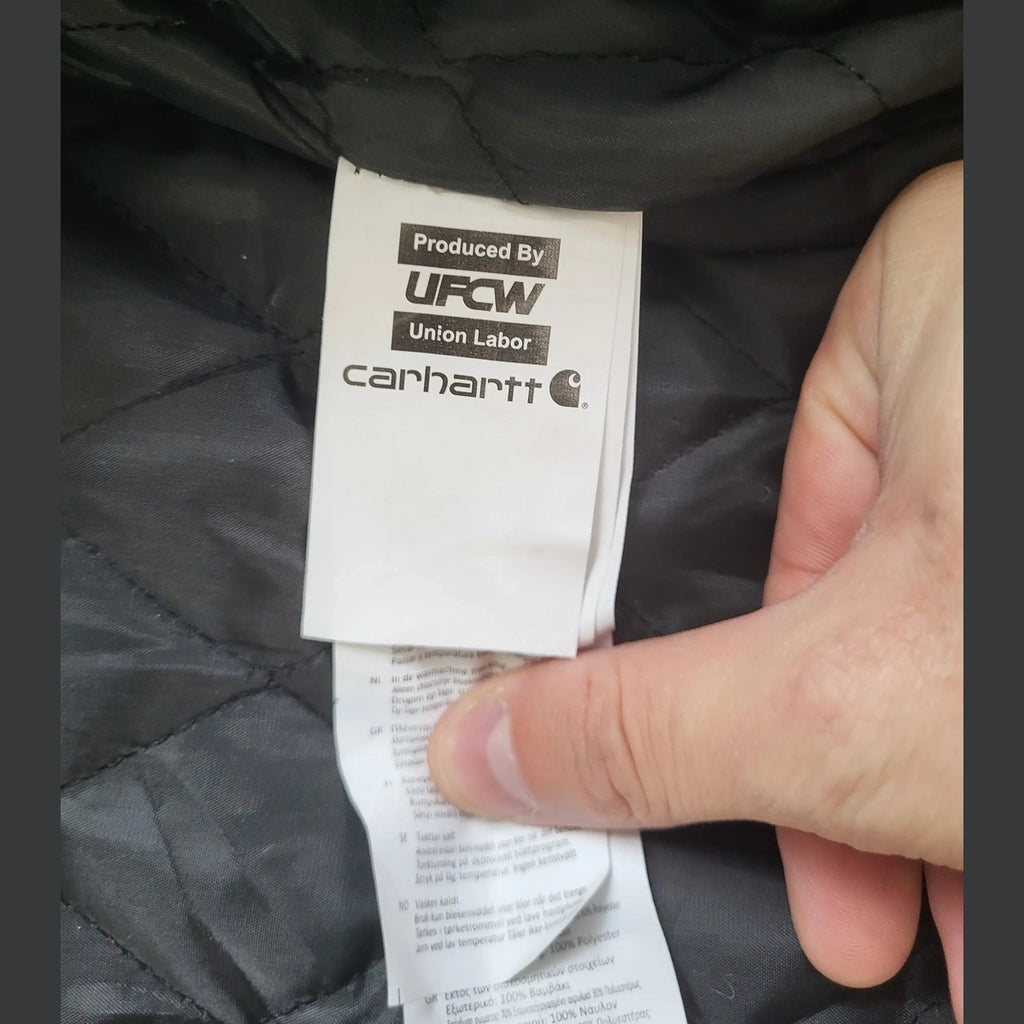 Veste Carhartt kaki, taille XL, étiquette visible. Fripes Sélect