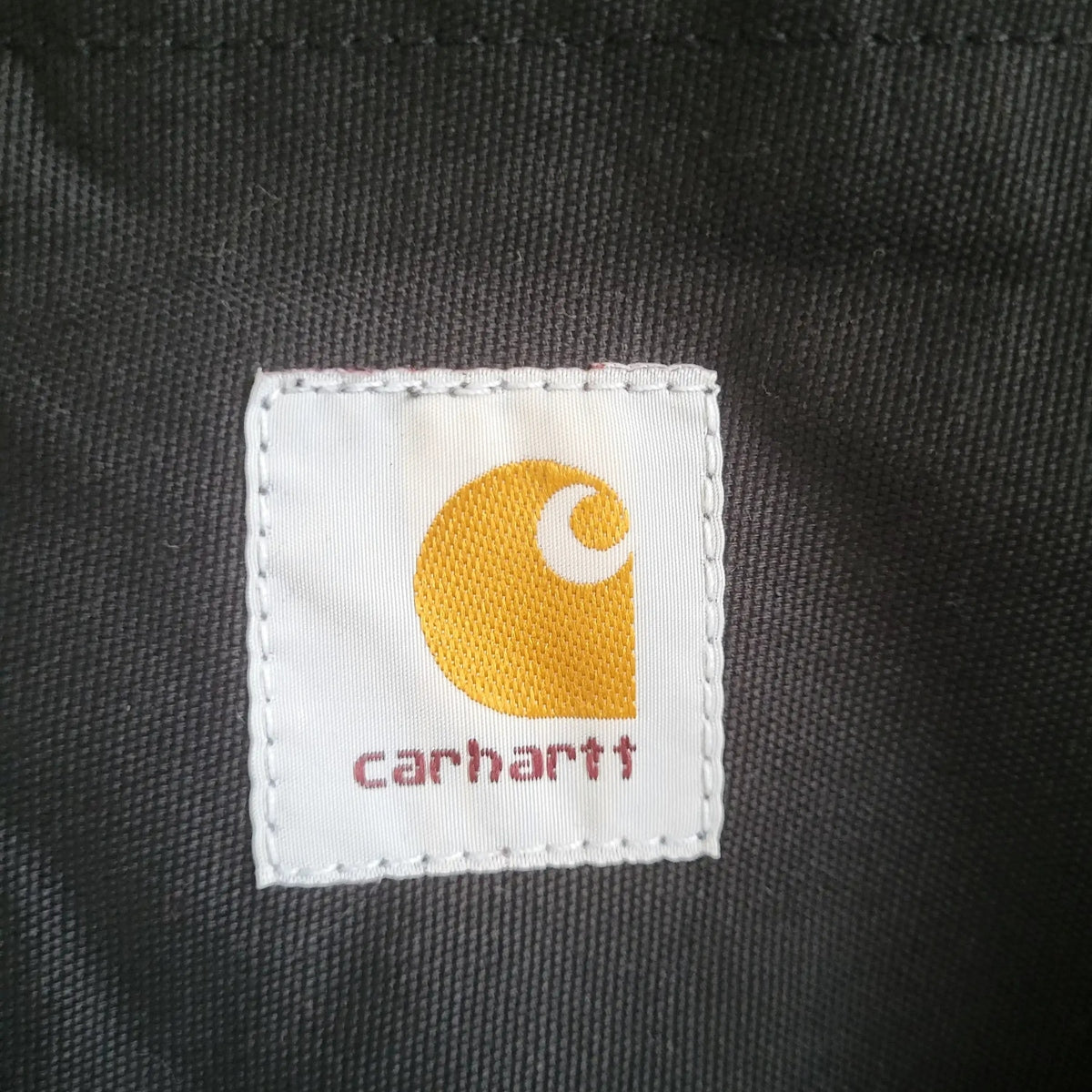 Veste Carhartt noire, taille L, logo visible, Fripes Sélect