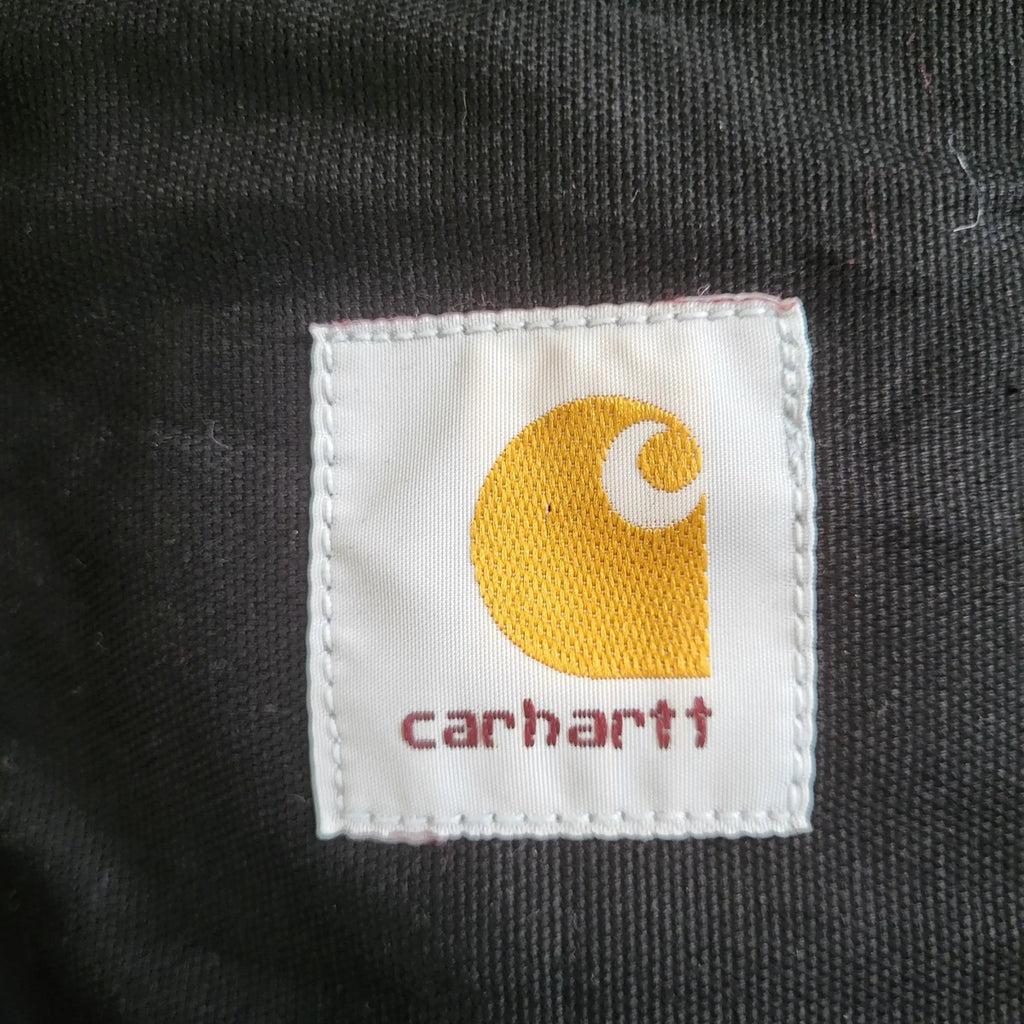 Veste Carhartt noire, taille S, logo visible sur étiquette. Fripes Sélect