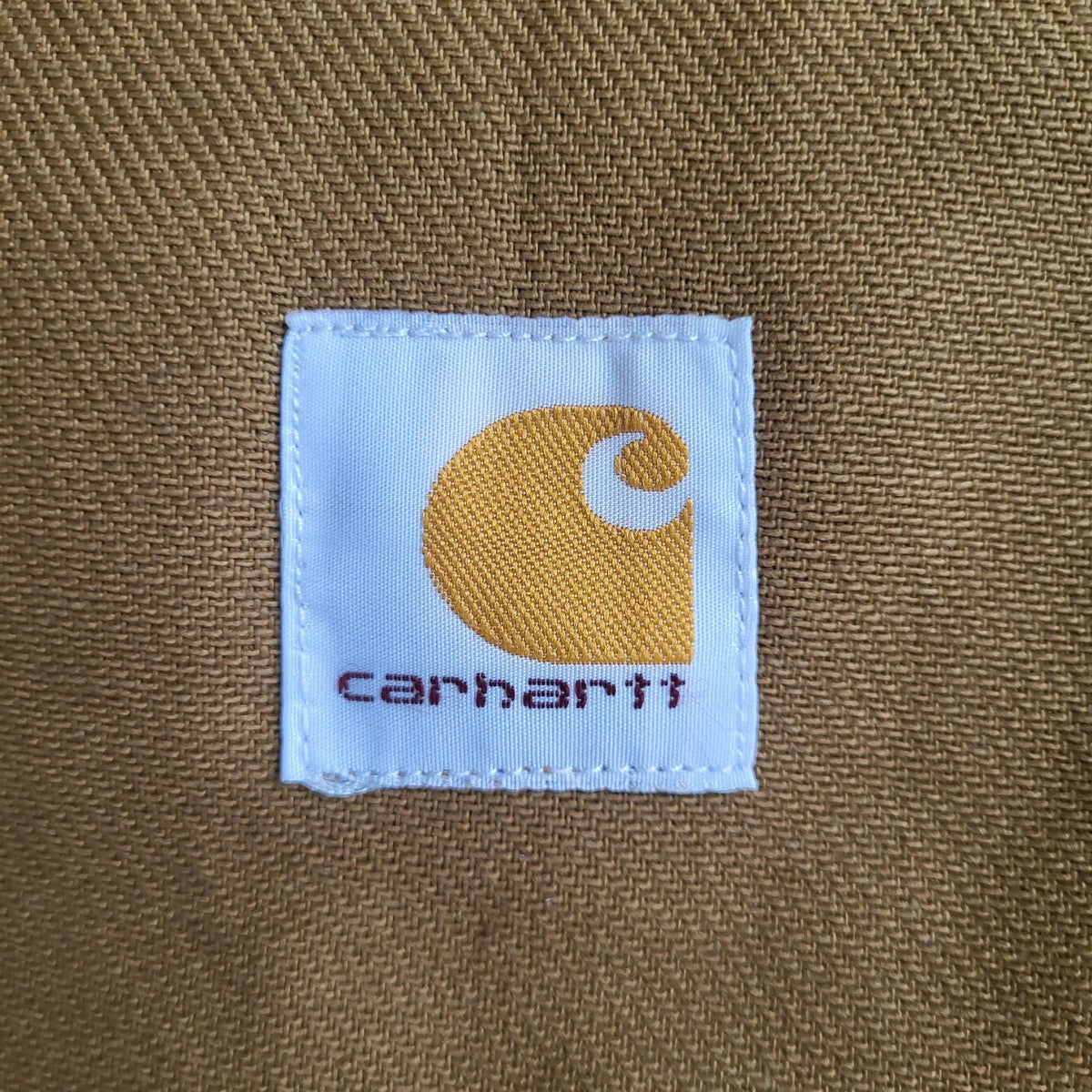 Veste Carhartt marron taille L, logo visible, vêtement vintage. Fripes Sélect