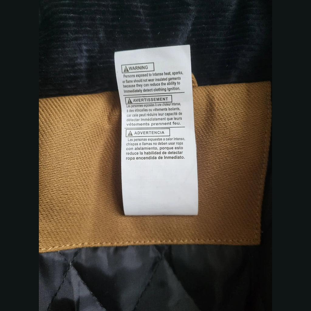Veste Carhartt marron taille XL, étiquette d'avertissement visible. Fripes Sélect