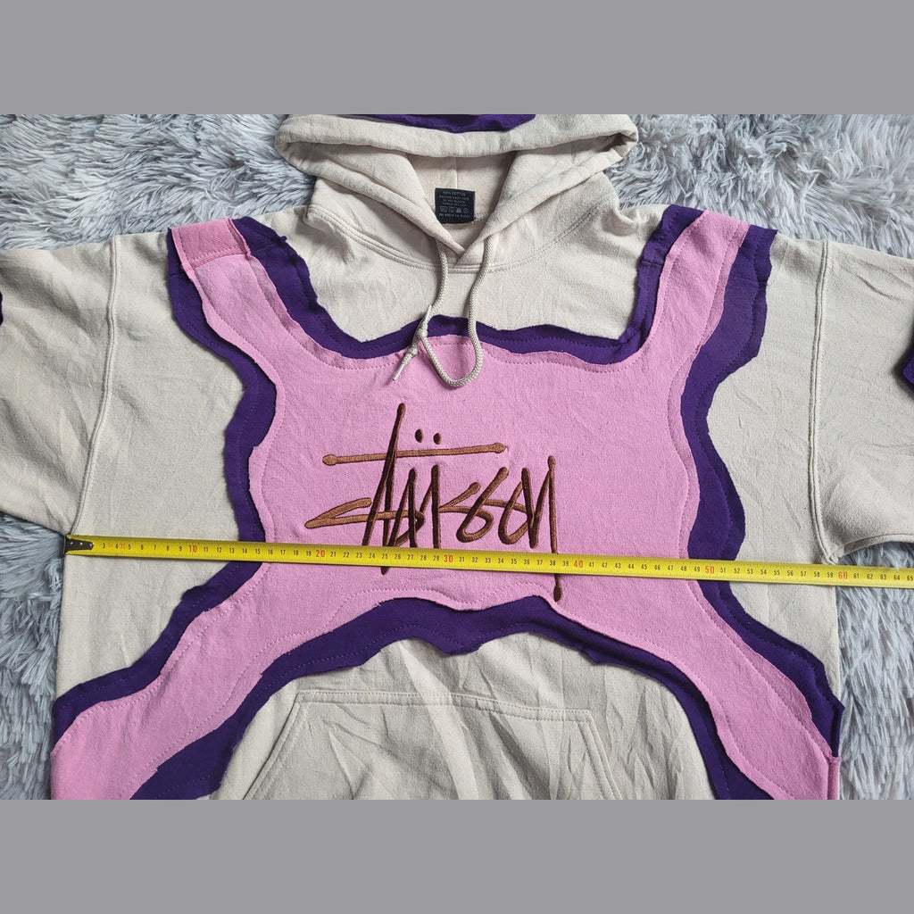 Sweat à capuche Stüssy beige, rose et violet, taille XL. Fripes Sélect