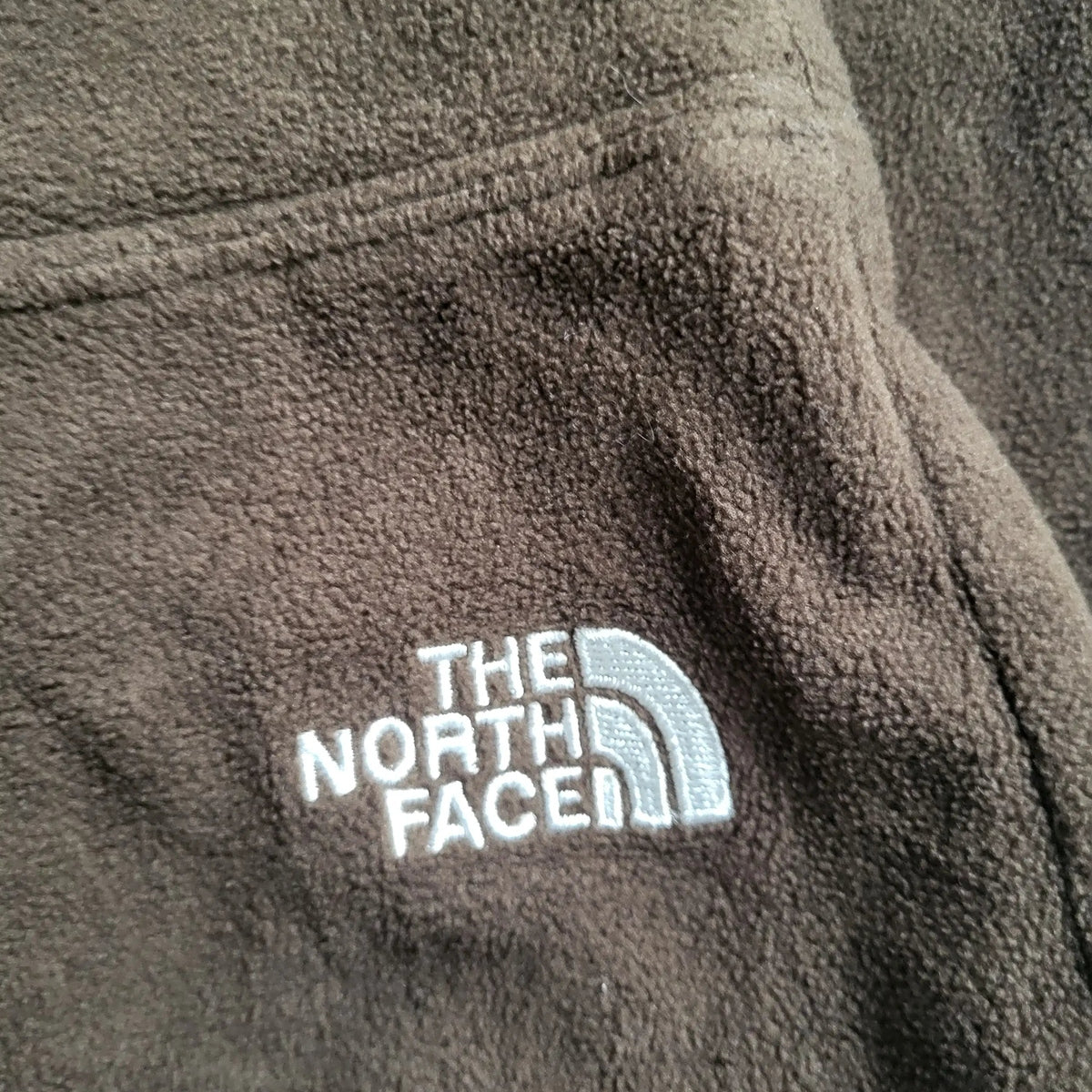 Veste polaire The North Face marron, taille non visible. Fripes Sélect