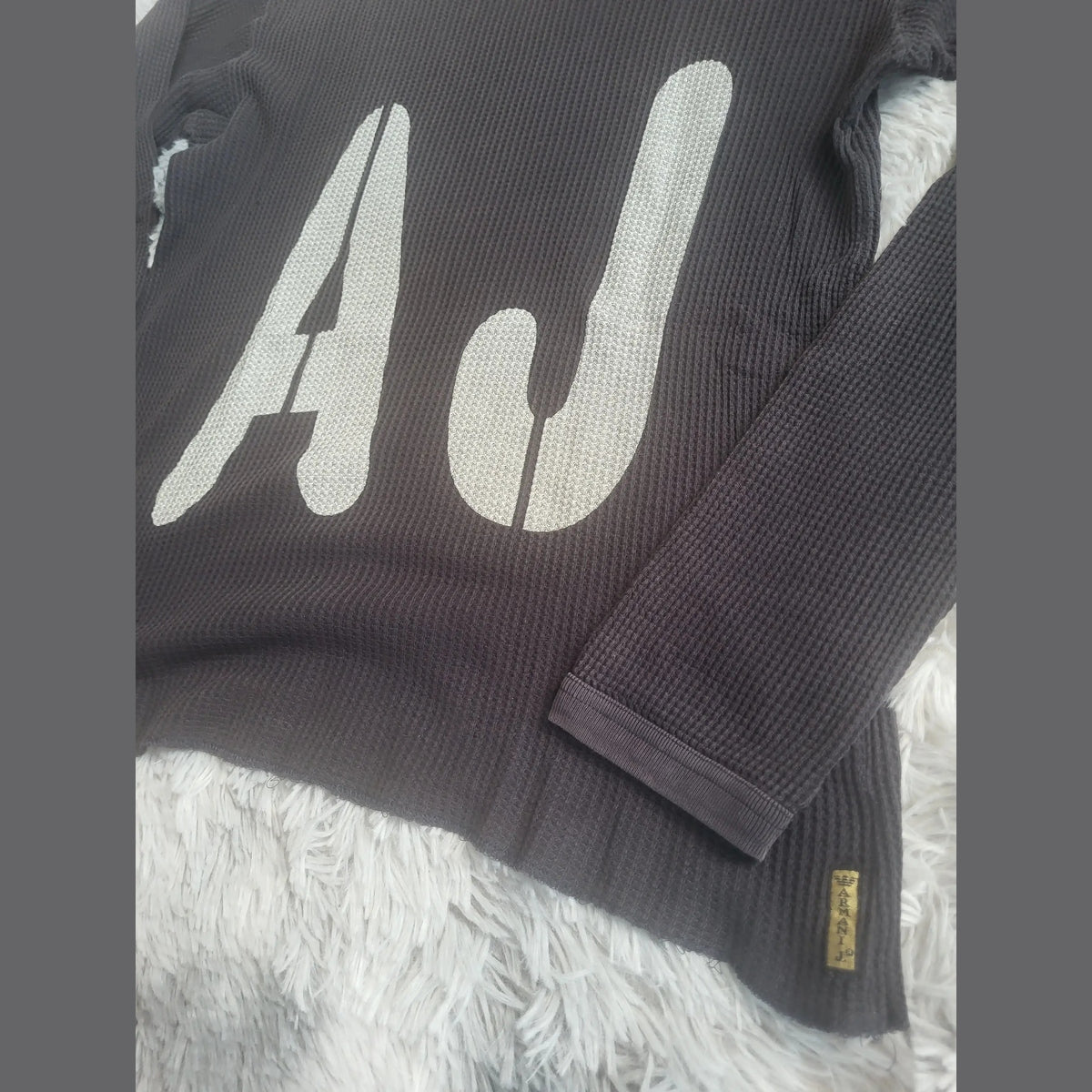 Pull noir AJ Armani, col rond, taille non précisée, Fripes Sélect