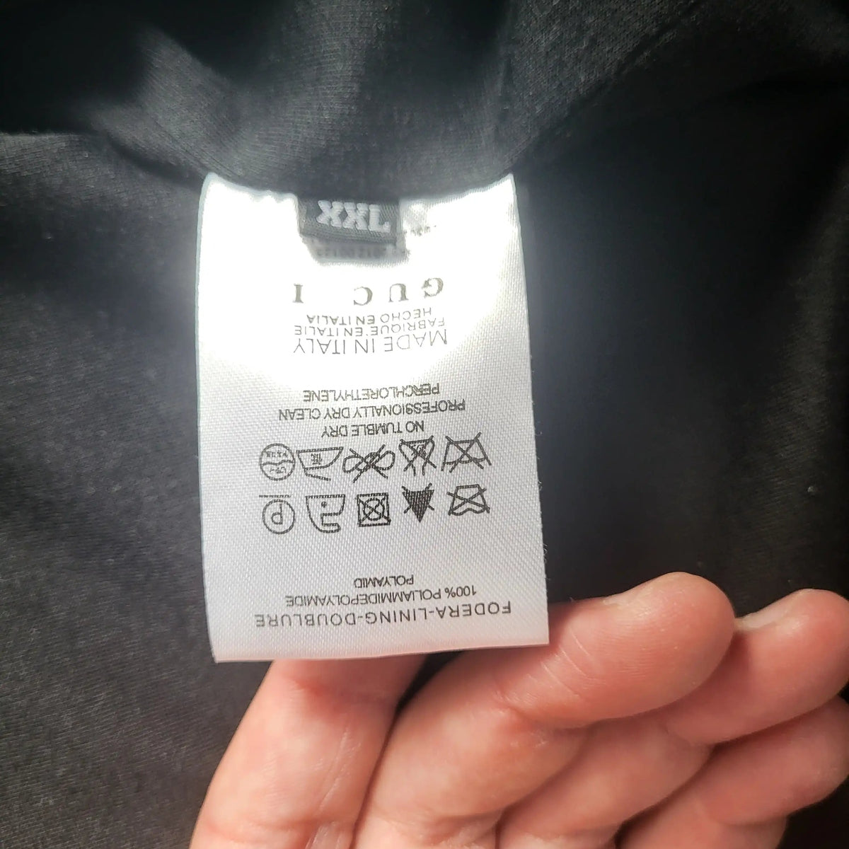 Veste noire Gucci, taille XXL, étiquette visible. Fripes Sélect