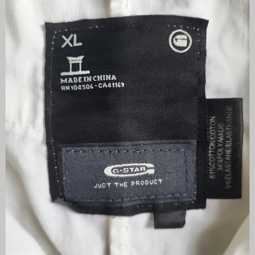 Chemise blanche G-Star taille XL, étiquette visible. Fripes Sélect
