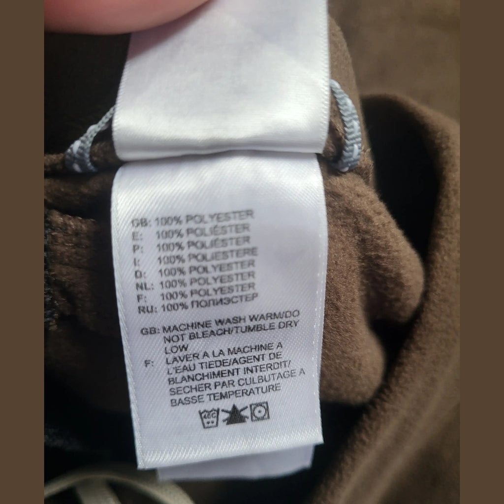Sweat marron en polyester, étiquette d'entretien visible, taille non indiquée. Fripes Sélect