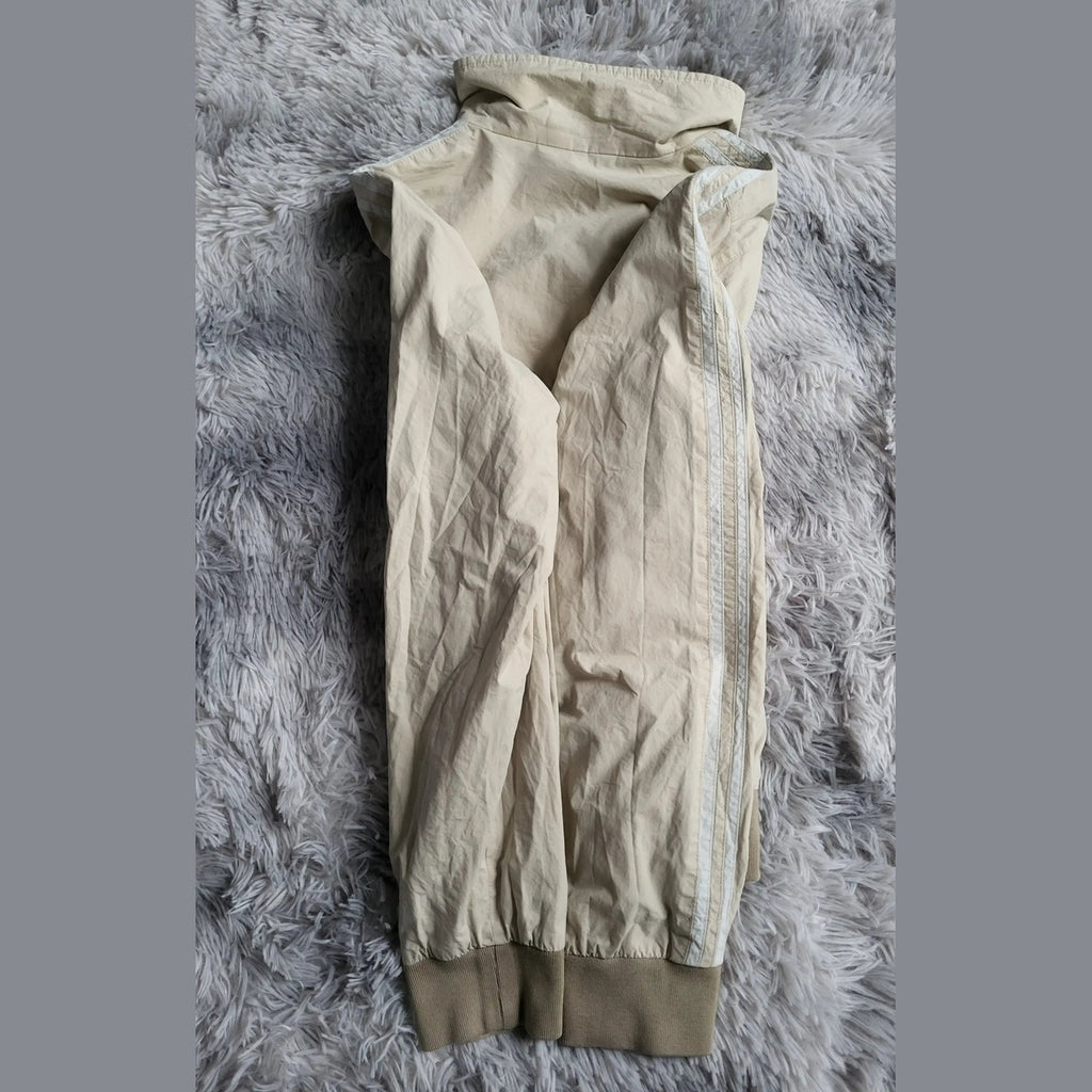 Pantalon de jogging beige, marque non visible, taille non indiquée. Fripes Sélect