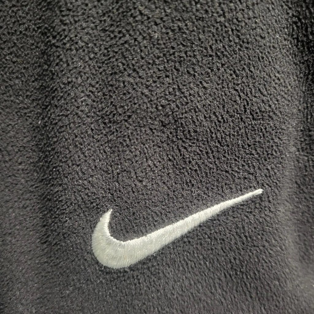 Veste polaire Nike noire, taille non indiquée, logo brodé. Fripes Sélect