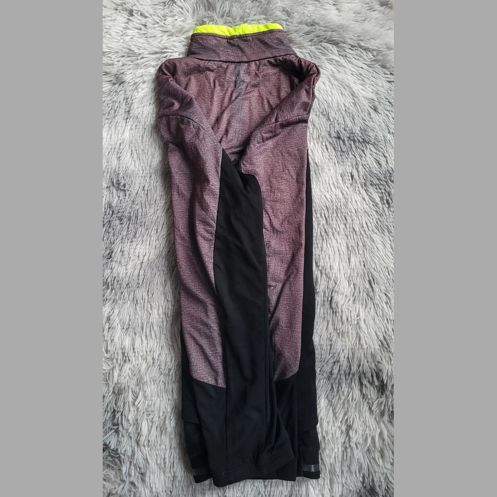 Legging de sport, marque non visible, coloris violet et noir, taille non indiquée. Fripes Sélect