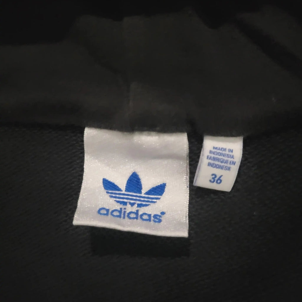 Veste Adidas noire taille 36, logo bleu visible. Fripes Sélect