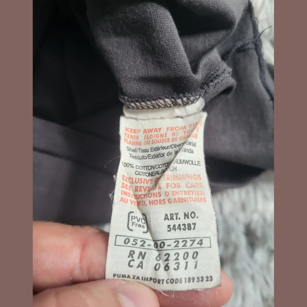 T-shirt Puma noir, taille non visible, étiquette intérieure Fripes Sélect