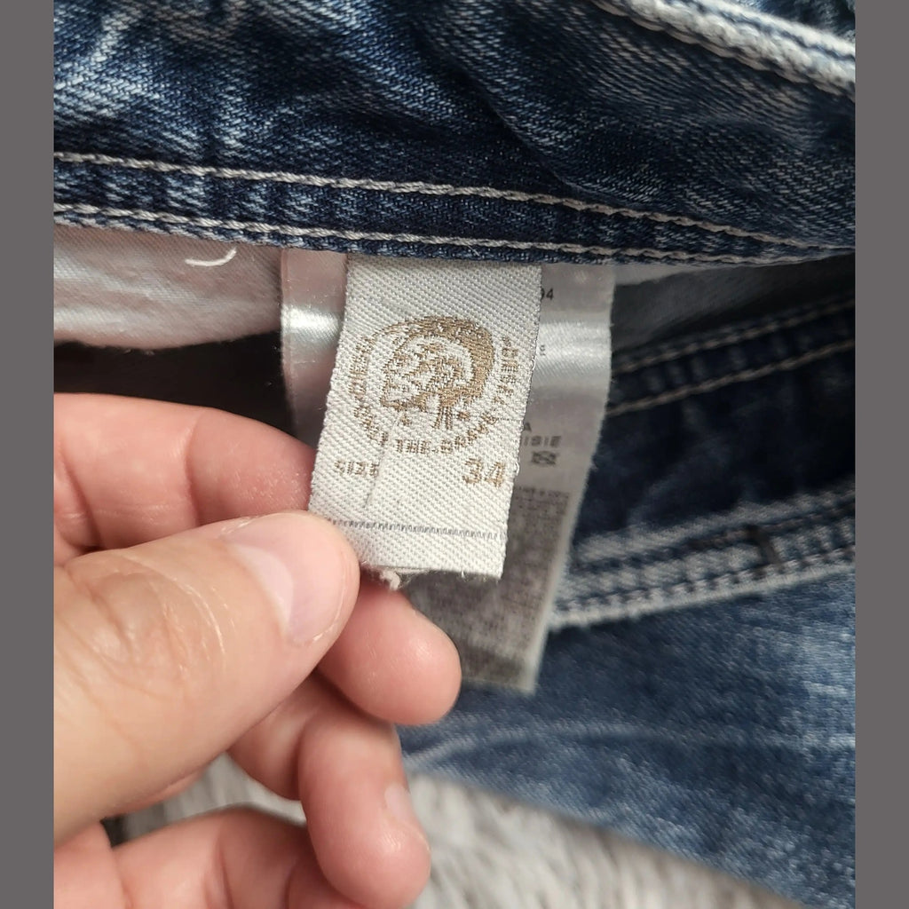 Jean bleu The North Face taille 34, étiquette visible. Fripes Sélect