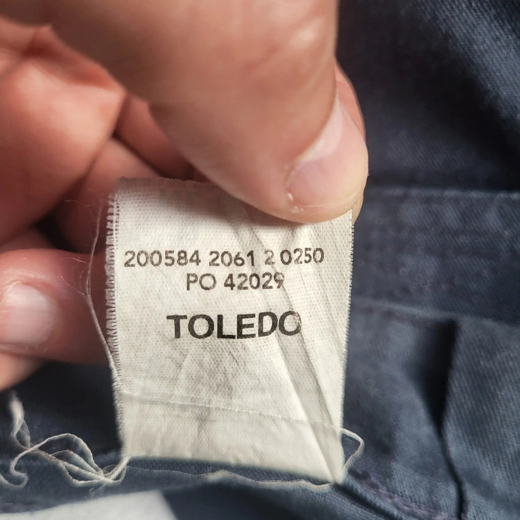 Pantalon Toledo bleu, taille non indiquée, étiquette visible. Fripes Sélect