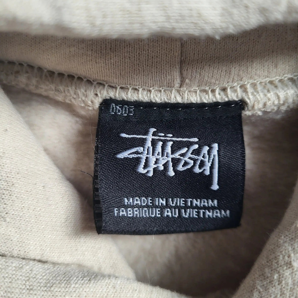Sweat beige Stüssy taille S, étiquette visible. Fripes Sélect