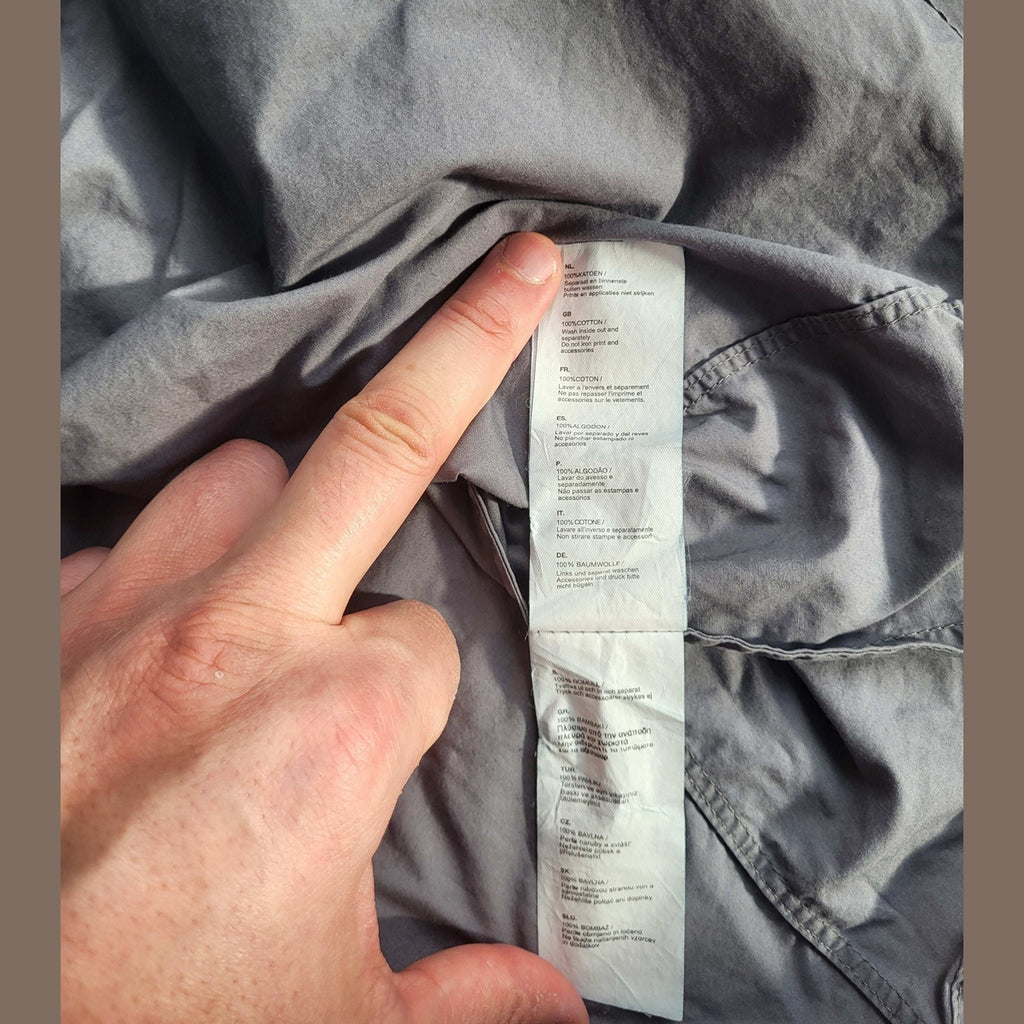 Chemise grise, marque non visible, 100% coton, taille non précisée. Fripes Sélect