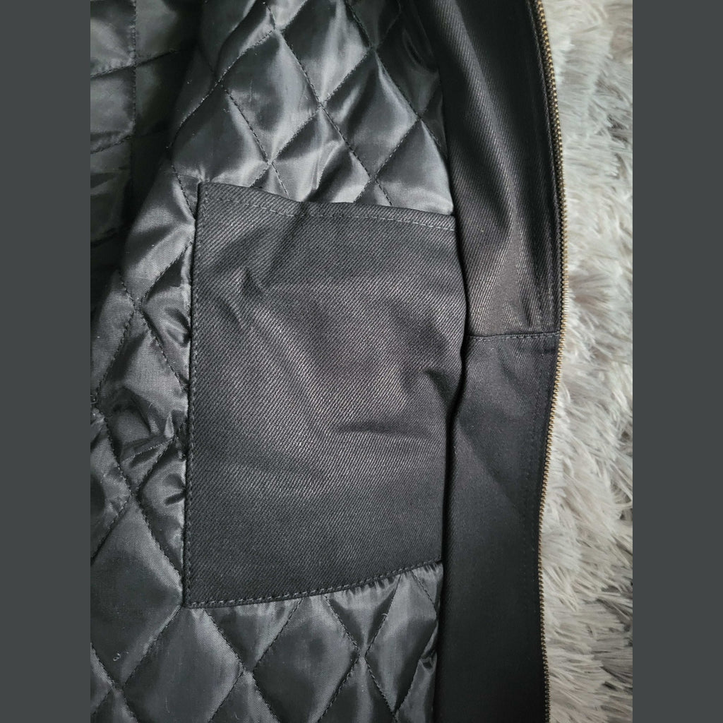 Veste matelassée noire, poche intérieure, taille non visible, Fripes Sélect